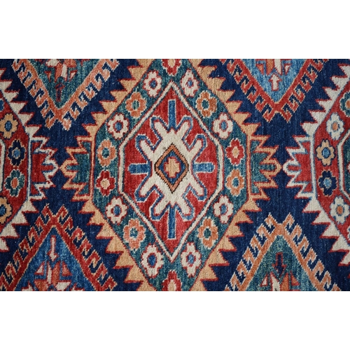 598 - Eastern Red and Blue Ground Wool Rug decorated with six guls within a deep border, approx. 151cm x 1... 