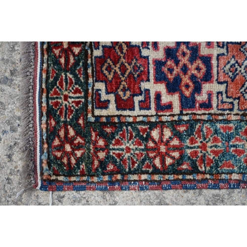 598 - Eastern Red and Blue Ground Wool Rug decorated with six guls within a deep border, approx. 151cm x 1... 