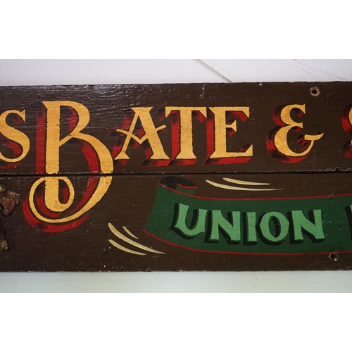 115 - A Chas Bate & Son hand painted wooden brewery sign, measures approx 183cm in length.