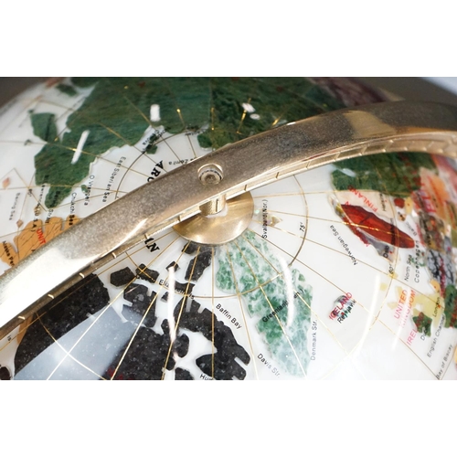 159 - A contemporary table top globe made with semi precious stones on gilt metal frame with compass to ba... 