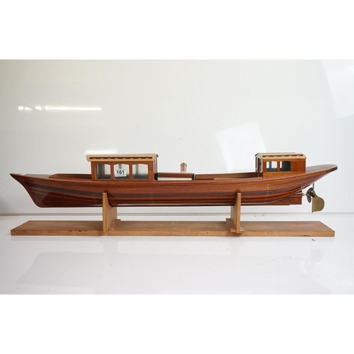 161 - A kit built wooden model steam boat together with a box of spare parts.