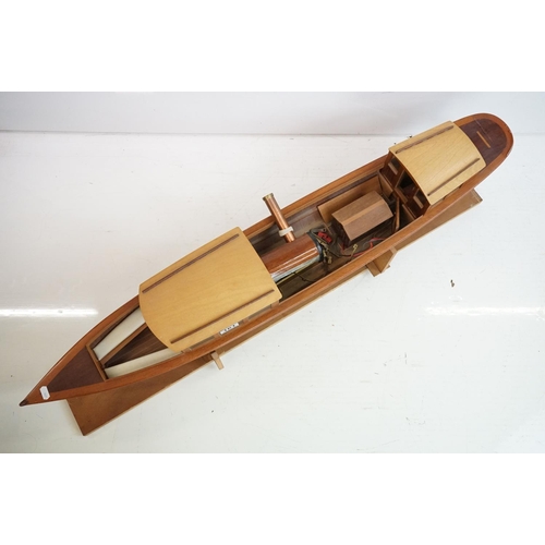 161 - A kit built wooden model steam boat together with a box of spare parts.