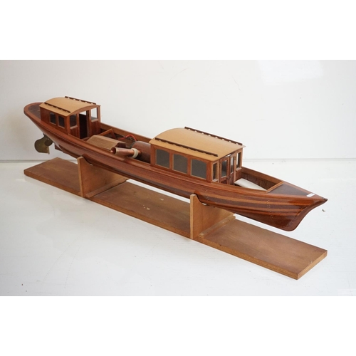 161 - A kit built wooden model steam boat together with a box of spare parts.