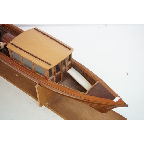 161 - A kit built wooden model steam boat together with a box of spare parts.