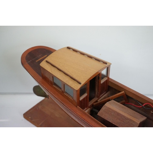 161 - A kit built wooden model steam boat together with a box of spare parts.