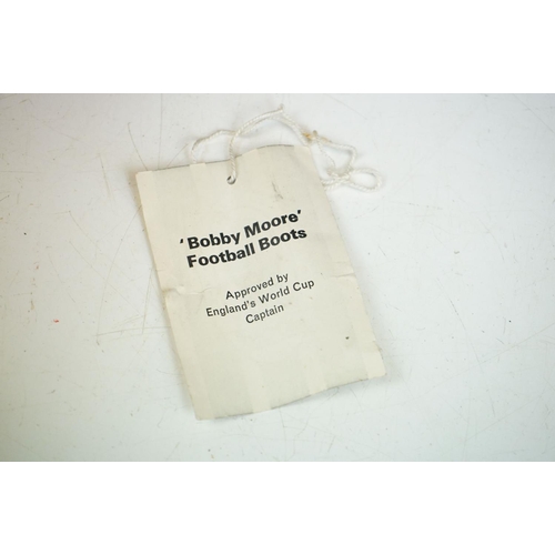 396 - A pair of 1960's 'Bobby Moore' football boots approved by England's World Cup captain.