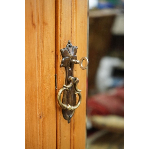 587 - Victorian Satin Walnut Wardrobe, the single mirrored door opening to a hanging space with rails and ... 