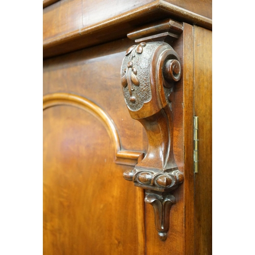 591 - Victorian Mahogany Double Wardrobe, the two panel doors opening to a hanging space with rail and peg... 