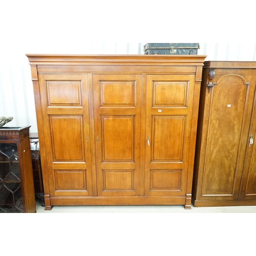 592 - Large Victorian style Mahogany Triple Hall Cupboard or Wardrobe, two panel doors opening to a hangin... 