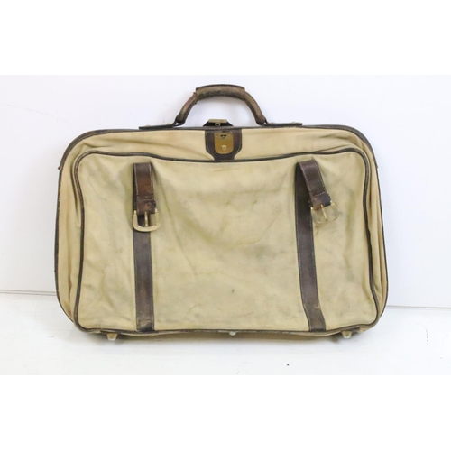 432 - Leather fitted suitcase together with a canvas example.