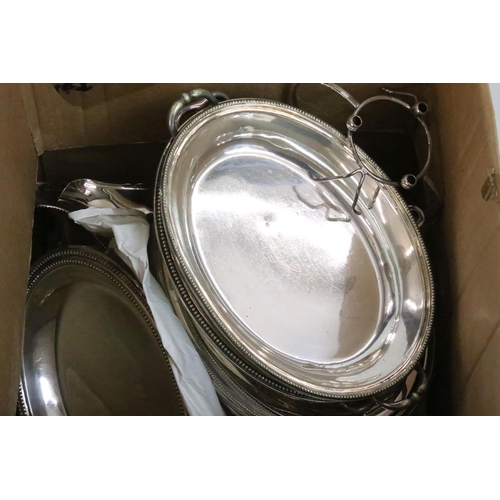 434 - A Victorian silver plated breakfast dish, a silver handled fruit bowl, two oval entree dishes and mu... 