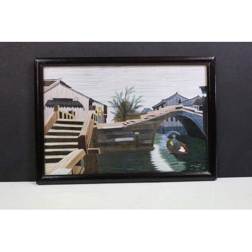 438 - A Chinese framed and glazed double sided silk picture of a boat on canal in gift box.