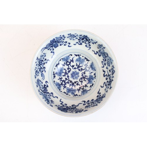 16 - Chinese 19th Century blue and white porcelain bowl being hand painted with floral and precious objec... 