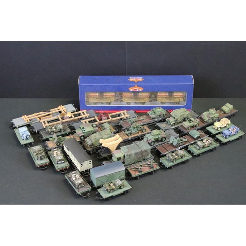 64 - 25 OO gauge items of military rolling stock to include ltd edn Wolf Wagons and Bachmann examples plu... 