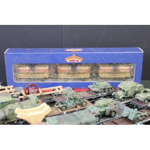 64 - 25 OO gauge items of military rolling stock to include ltd edn Wolf Wagons and Bachmann examples plu... 