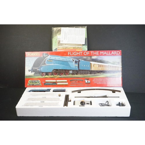 121 - Two boxed Hornby OO gauge electric train sets to include R1171 Flight of The Mallard and R1144 Night... 