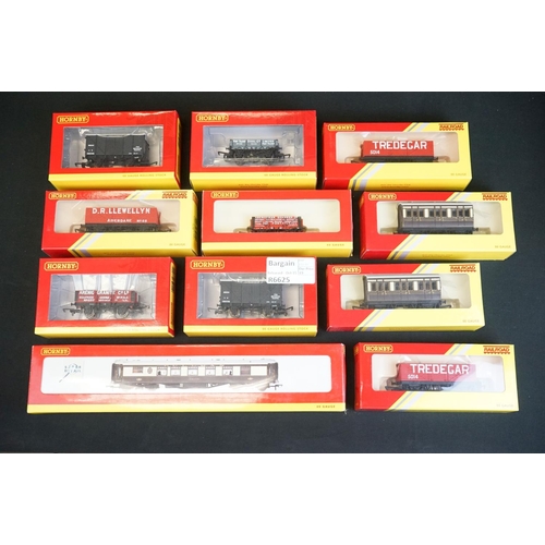 59 - 29 Boxed Hornby OO gauge items of rolling stock to include R4302B, R4306B, R4320A, R4165, R4164 etc