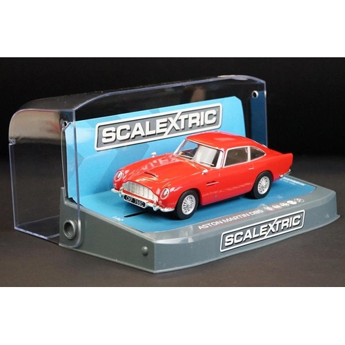 263 - Three cased Scalextric slot cars to include C3722 Aston Martin DB5 red, C3730 Jaguar D Type Nurburgr... 