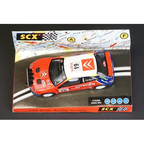 273 - Six cased SCX 1:32 Scale Racing System slot cars to include 60740 Citroen Xsara WRC 