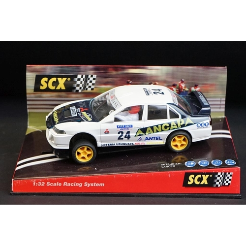 274 - Six cased SCX 1:32 Scale Racing System slot cars, to include 60010 Mitsubishi Lancer 