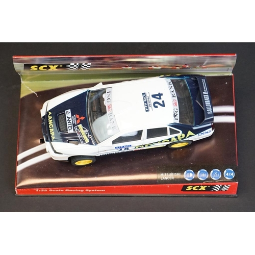 274 - Six cased SCX 1:32 Scale Racing System slot cars, to include 60010 Mitsubishi Lancer 