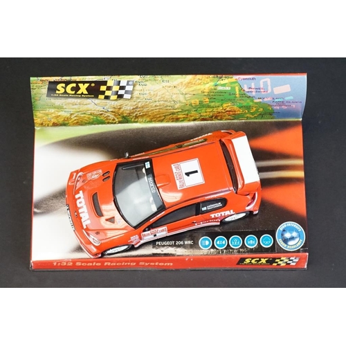 274 - Six cased SCX 1:32 Scale Racing System slot cars, to include 60010 Mitsubishi Lancer 