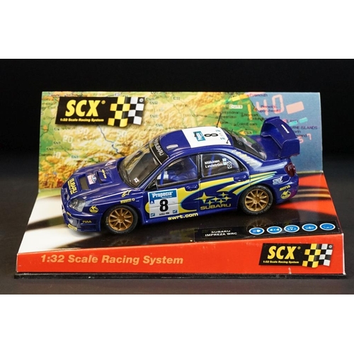 274 - Six cased SCX 1:32 Scale Racing System slot cars, to include 60010 Mitsubishi Lancer 