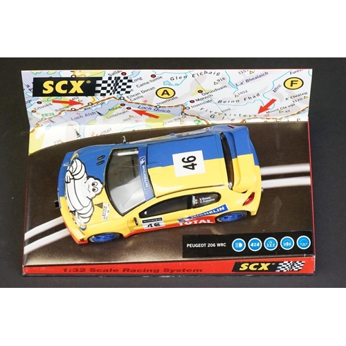 274 - Six cased SCX 1:32 Scale Racing System slot cars, to include 60010 Mitsubishi Lancer 