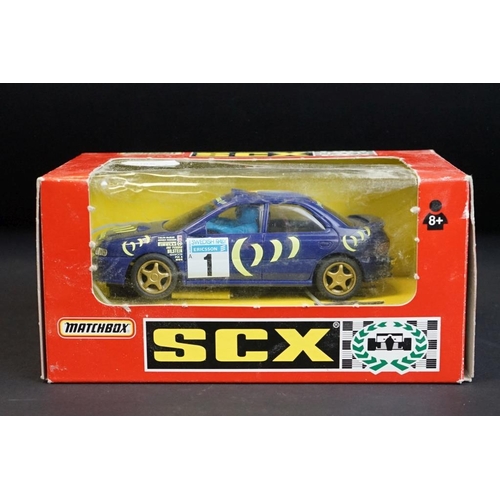 275 - Seven boxed Matchbox SCX slot cars to include Volvo 850T (83920.20), Bugatti (83870.20 - missing win... 