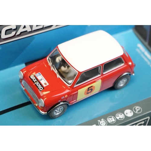 278 - Four cased Scalextric slot cars to include C2920 Ford Escort RS 1600 No 1, C3612 Chevrolet Camaro 19... 