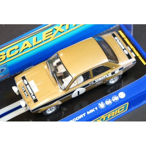 278 - Four cased Scalextric slot cars to include C2920 Ford Escort RS 1600 No 1, C3612 Chevrolet Camaro 19... 