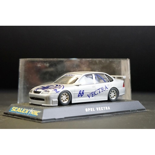 281 - Four cased Scalextric slot cars to include C.2000 Opel Vectra Promarkt, C.2091 BMW Teleshop, C.2006 ... 