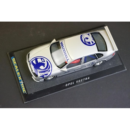 281 - Four cased Scalextric slot cars to include C.2000 Opel Vectra Promarkt, C.2091 BMW Teleshop, C.2006 ... 