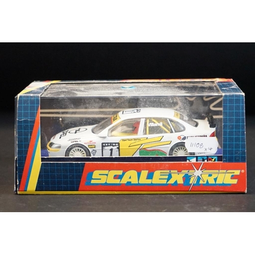 281 - Four cased Scalextric slot cars to include C.2000 Opel Vectra Promarkt, C.2091 BMW Teleshop, C.2006 ... 