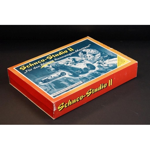 282 - Two boxed Schuco Studio clockwork tin plate model kit sets to include Studio III Bausatz Montagekast... 