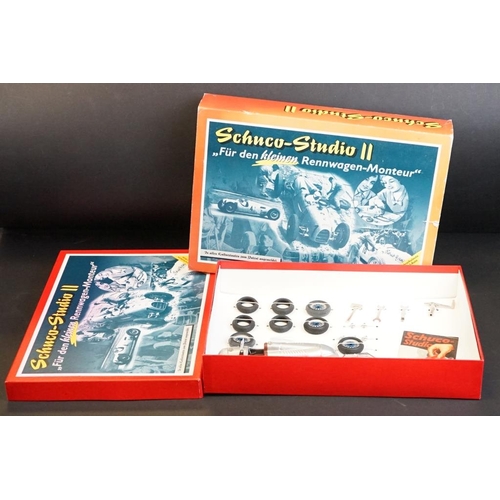 282 - Two boxed Schuco Studio clockwork tin plate model kit sets to include Studio III Bausatz Montagekast... 