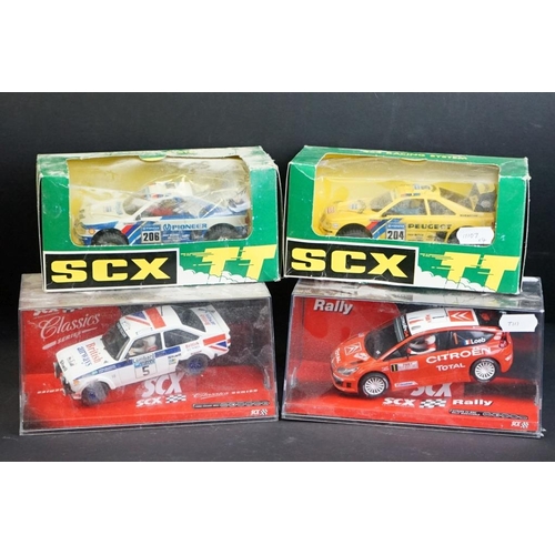 283 - Four boxed / cased SCX slot cars to include 2 x SCX TT 4x4 Racing System (73020 Peugeot 405 