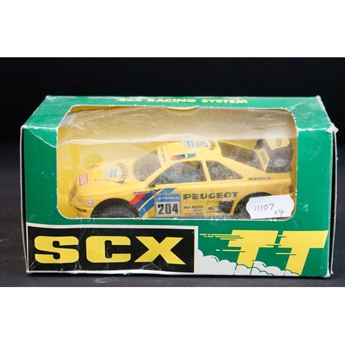 283 - Four boxed / cased SCX slot cars to include 2 x SCX TT 4x4 Racing System (73020 Peugeot 405 