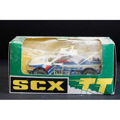 283 - Four boxed / cased SCX slot cars to include 2 x SCX TT 4x4 Racing System (73020 Peugeot 405 