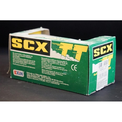 283 - Four boxed / cased SCX slot cars to include 2 x SCX TT 4x4 Racing System (73020 Peugeot 405 