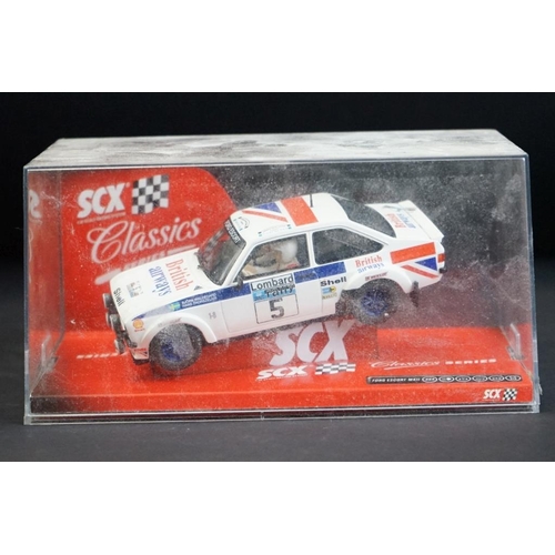 283 - Four boxed / cased SCX slot cars to include 2 x SCX TT 4x4 Racing System (73020 Peugeot 405 