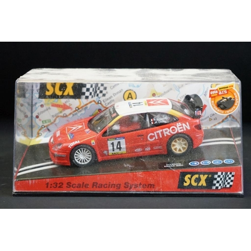 284 - Six cased SCX slot cars to include 60800 Subaru Impreza WRC, 60200 Chevrolet Nascar, 60130 Seat Ibiz... 