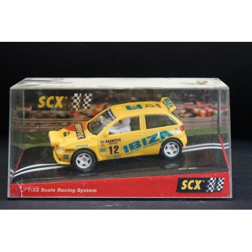 284 - Six cased SCX slot cars to include 60800 Subaru Impreza WRC, 60200 Chevrolet Nascar, 60130 Seat Ibiz... 