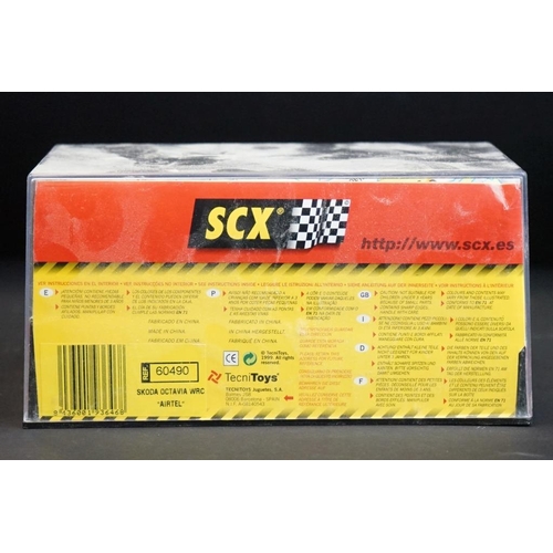 284 - Six cased SCX slot cars to include 60800 Subaru Impreza WRC, 60200 Chevrolet Nascar, 60130 Seat Ibiz... 