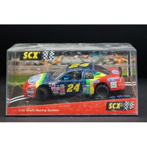 284 - Six cased SCX slot cars to include 60800 Subaru Impreza WRC, 60200 Chevrolet Nascar, 60130 Seat Ibiz... 