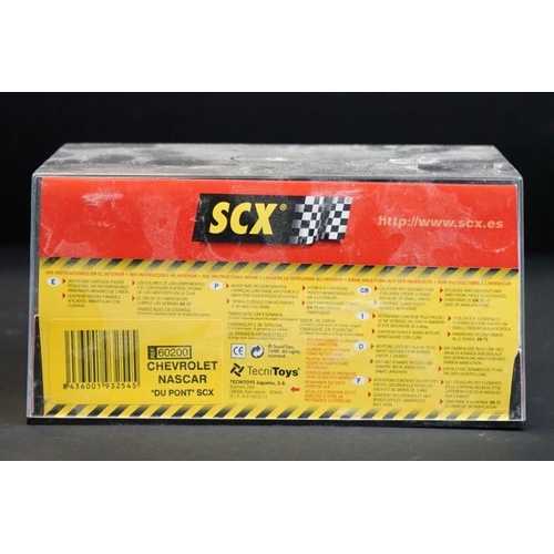 284 - Six cased SCX slot cars to include 60800 Subaru Impreza WRC, 60200 Chevrolet Nascar, 60130 Seat Ibiz... 