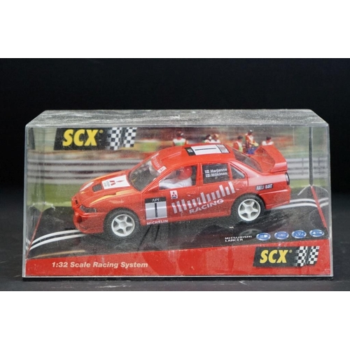 284 - Six cased SCX slot cars to include 60800 Subaru Impreza WRC, 60200 Chevrolet Nascar, 60130 Seat Ibiz... 