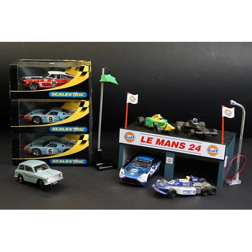 287 - Three cased Scalextric slot cars to include C2403 Ford GT 40 1968 No 9, C2404 Ford GT40 1969 No 6, C... 