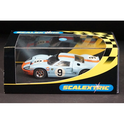 287 - Three cased Scalextric slot cars to include C2403 Ford GT 40 1968 No 9, C2404 Ford GT40 1969 No 6, C... 