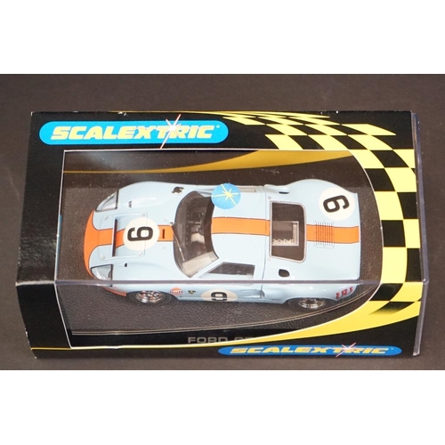 287 - Three cased Scalextric slot cars to include C2403 Ford GT 40 1968 No 9, C2404 Ford GT40 1969 No 6, C... 